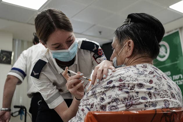August 2, 2021, Jerusalem, Israel: Paramedics from Magen David Adom, serving as the Israeli Red Cross organization and leading EMS, deliver a 3rd BioNTech Pfizer booster vaccine to seniors at the Mishan Gonen Assisted Living Residence for the elderly. PM Bennett announced his goal of vaccinating all Israeli seniors, 60 and above, with a 3rd vaccine by the end of August 2021, in spite of the fact that a booster shot has not yet been approved by the US FDA. Jerusalem Israel - ZUMAa126 20210802_zap_a126_011 Copyright: xNirxAlonx
