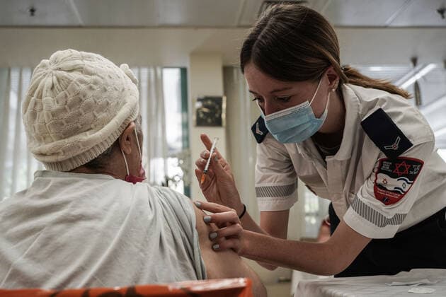 August 2, 2021, Jerusalem, Israel: Paramedics from Magen David Adom, serving as the Israeli Red Cross organization and leading EMS, deliver a 3rd BioNTech Pfizer booster vaccine to seniors at the Mishan Gonen Assisted Living Residence for the elderly. PM Bennett announced his goal of vaccinating all Israeli seniors, 60 and above, with a 3rd vaccine by the end of August 2021, in spite of the fact that a booster shot has not yet been approved by the US FDA. Jerusalem Israel - ZUMAa126 20210802_zap_a126_017 Copyright: xNirxAlonx