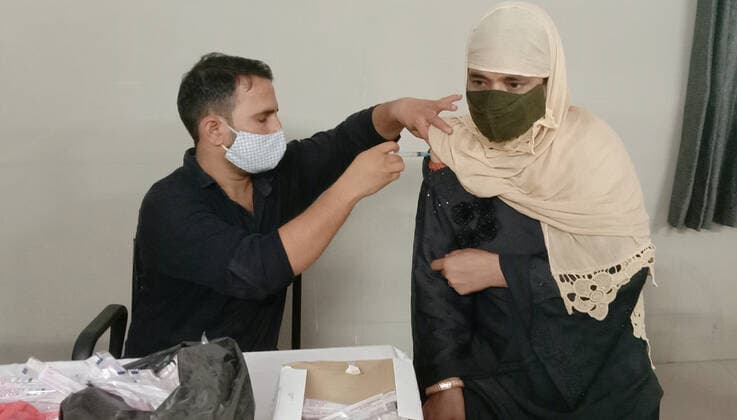 GHAZIABAD, INDIA - AUGUST 1: A health worker administers a dose of Covid-19 vaccine to a beneficiary, at CHC Health Centre, Dasna, on August 1, 2021 in Ghaziabad, India. (Photo by Sakib Ali Hindustan Times) COVID-19 Vaccination Drive