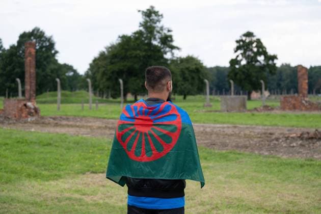August 2, 2021, Brzezinka, Poland: A Gypsy seen standing at the former camp Auschwitz II Birkenau..Roma and Sinti Genocide Remembrance Day. 77 years ago, on the night of 2 to 3 August 1944, the Germans liquidated the camp for Gypsies (Zigeunerfamilienlager) in KL Auschwitz II Birkenau. The anniversary was organized at the former camp Auschwitz II-Birkenau. Brzezinka Poland - ZUMAs197 20210802_zaa_s197_094 Copyright: xWojciechxGrabowskix