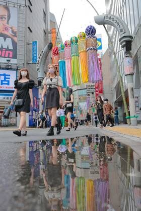 August 2, 2021, Tokyo, Japan: Pedestrians wearing face masks as a precaution against the spread of covid-19 walk underneath Tanabata decoration in Shibuya district, amid the covid-19 pandemic. Tokyo Japan - ZUMAs197 20210802_zab_s197_048 Copyright: xStanislavxKogikux