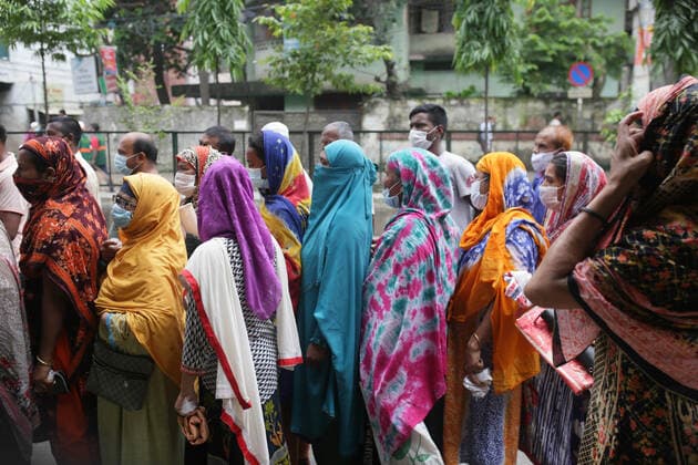 August 3, 2021, Dhaka, Bangladesh: People queue to buy food at the open market during the nationwide lockdown in Dhaka. Dhaka Bangladesh - ZUMAh143 20210803_zap_h143_001 Copyright: xMDxMehedixHasanx