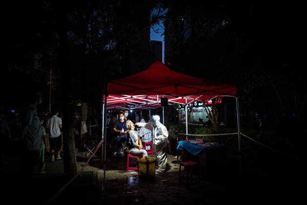 (210803) -- WUHAN, Aug. 3, 2021 -- A medical worker takes a swab sample from a resident for COVID-19 nucleic acid testing in Wuhan, central China s Hubei Province, Aug. 3, 2021. Wuhan City, capital of central China s Hubei Province, launched another citywide COVID-19 nucleic acid testing campaign on Tuesday, according to a press conference held by the provincial COVID-19 prevention and control headquarters. Wuhan, once hard-hit by COVID-19, identified new local clusters of cases on Monday when seven migrant workers at the Wuhan Economic & Technological Development Zone tested positive for the coronavirus. ) CHINA-HUBEI-WUHAN-COVID-19-TESTING (CN) XiaoxYijiu