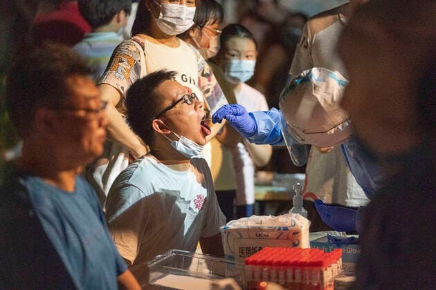 (210803) -- WUHAN, Aug. 3, 2021 -- A medical worker takes a swab sample from a resident for COVID-19 nucleic acid testing in Wuhan, central China s Hubei Province, Aug. 3, 2021. Wuhan City, capital of central China s Hubei Province, launched another citywide COVID-19 nucleic acid testing campaign on Tuesday, according to a press conference held by the provincial COVID-19 prevention and control headquarters. Wuhan, once hard-hit by COVID-19, identified new local clusters of cases on Monday when seven migrant workers at the Wuhan Economic & Technological Development Zone tested positive for the coronavirus. ) CHINA-HUBEI-WUHAN-COVID-19-TESTING (CN) XiongxQi