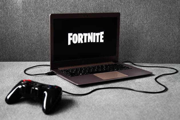 Video Games Photo Illustrations Fortnite logo displayed on a laptop screen and a gamepad are seen in this illustration photo taken in Krakow, Poland on August 5, 2021. Krakow Poland porzycki-videogam210805_nphOT  Copyright: xJakubxPorzyckix