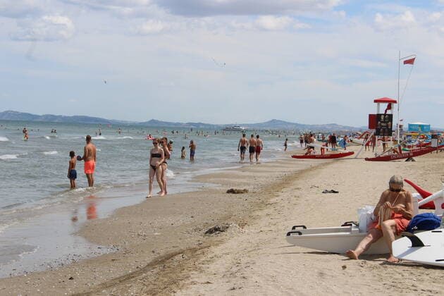 August 6, 2021, Rimini, Italy: Green pass doesn t stop Ferragosto, the Italians mid-August vacation on the beaches. In Rimini and Rivieira Romanhola region, the coast is starting to get crowded even with the green certificate being mandatory. And there are many tourists arriving in the city. Since the 6th of August, the Green Pass is mandatory in Italy. Green Pass is mandatory only to enter some closed places, such as restaurants and bars, if you intend to sit and eat at the table, but also in discos, museums, exhibitions, gyms, swimming pools, amusement parks, parties and health centers. The Government extended the mandatory green pass also for access to long-distance trains and planes.  Copyright: xJosixDonellix