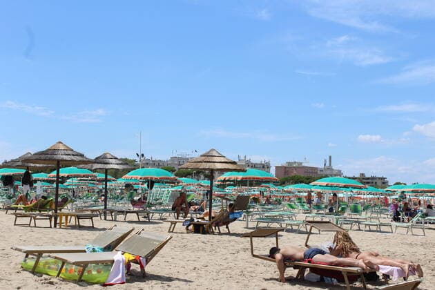 August 6, 2021, Rimini, Italy: Green pass doesn t stop Ferragosto, the Italians mid-August vacation on the beaches. In Rimini and Rivieira Romanhola region, the coast is starting to get crowded even with the green certificate being mandatory. And there are many tourists arriving in the city. Since the 6th of August, the Green Pass is mandatory in Italy. Green Pass is mandatory only to enter some closed places, such as restaurants and bars, if you intend to sit and eat at the table, but also in discos, museums, exhibitions, gyms, swimming pools, amusement parks, parties and health centers. The Government extended the mandatory green pass also for access to long-distance trains and planes.  Copyright: xJosixDonellix