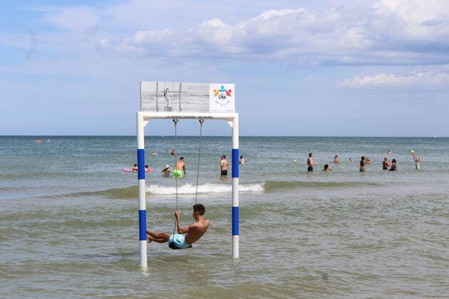 August 6, 2021, Rimini, Italy: Green pass doesn t stop Ferragosto, the Italians mid-August vacation on the beaches. In Rimini and Rivieira Romanhola region, the coast is starting to get crowded even with the green certificate being mandatory. And there are many tourists arriving in the city. Since the 6th of August, the Green Pass is mandatory in Italy. Green Pass is mandatory only to enter some closed places, such as restaurants and bars, if you intend to sit and eat at the table, but also in discos, museums, exhibitions, gyms, swimming pools, amusement parks, parties and health centers. The Government extended the mandatory green pass also for access to long-distance trains and planes.  Copyright: xJosixDonellix