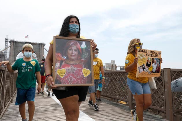 NY Covid March To Remember, Across The Brooklyn Bridge In New York City Marchers, some with yellow hearts, walk across the Brooklyn Bridge in remembrance of those who lost their lives during the Covid-19 pandemic, on August 7, 2021 in New York City, USA. The Yellow Hearts movement was started by a family that wanted to share a symbol of remembrance for those lost during the lockdown. New York City NY United States lamparski-nycovidm210807_npFjx  Copyright: xJohnxLamparskix