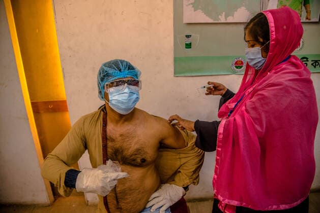 August 10, 2021, Barishal, Barishal, Bangladesh: A health worker inoculates a man with the jab of Astrazeneca Covid-19 coronavirus vaccine during a 2nd Dose Astrazeneca vaccination camp at Barishal in Bangladesh. Barishal Bangladesh - ZUMAr337 20210810_zip_r337_006 Copyright: xMustasinurxRahmanxAlvix