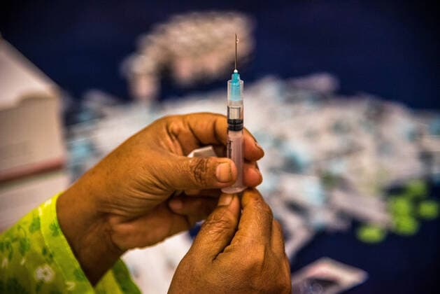 Astrazeneca 2nd Dose Vaccination Campaign In Bangladesh BARISHAL, BANGLADESH- AUGUST 10: Health worker prepares the second dose of AstraZeneca vaccine during a health program against Covid-19, as attempt to reduce infections by coronavirus, after the positive cases are increase with the Delta variant on August 10, 2021 Barishal, Bangladesh. Copyright: xMustasinurxRahmanxAlvix EYEPIXGROUP_MRA_10082021_11845