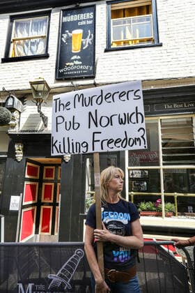 August 10, 2021, Norwich, United Kingdom: A protester holds a sign during the demonstration..Anti vax-passport protesters visit Norwich to highlight the discrimination they believe is taking place at The Murderers pub. The landlord Phil Cutter has introduced a new no jab, no entry rule that he says protects both his staff and customers. Norwich United Kingdom - ZUMAs197 20210810_zaa_s197_291 Copyright: xMartinxPopex