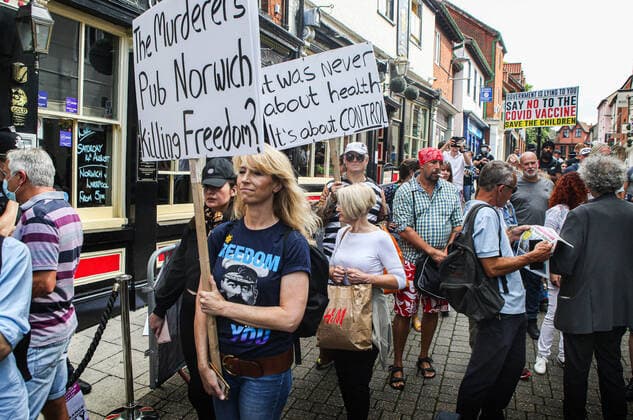 August 10, 2021, Norwich, United Kingdom: Protesters hold placards while marching on the street during the demonstration..Anti vax-passport protesters visit Norwich to highlight the discrimination they believe is taking place at The Murderers pub. The landlord Phil Cutter has introduced a new no jab, no entry rule that he says protects both his staff and customers. Norwich United Kingdom - ZUMAs197 20210810_zaa_s197_295 Copyright: xMartinxPopex