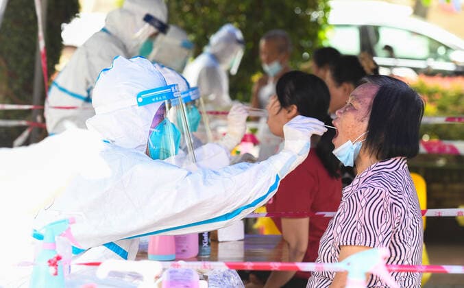 (210811) -- HAIKOU, Aug. 11, 2021 -- A medical worker takes a swab sample from a citizen at a COVID-19 nucleic acid testing site in Yunlong Township of Haikou, south China s Hainan Province, Aug. 11, 2021. Yunlong launched its thrid round of mass nucleic acid testing on Wednesday. ) CHINA-HAIKOU-YUNLONG-COVID-19-TESTING (CN) YangxGuanyu 
