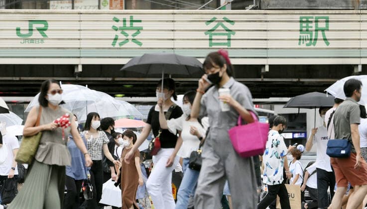 Virus stays rampant in Tokyo People wearing face masks walk in Tokyo s Shibuya area on Aug. 12, 2021, as the capital reported 4,989 new coronavirus cases the same day, the second highest figure after 5,042 infections logged a week earlier.  A14AA0000757693P