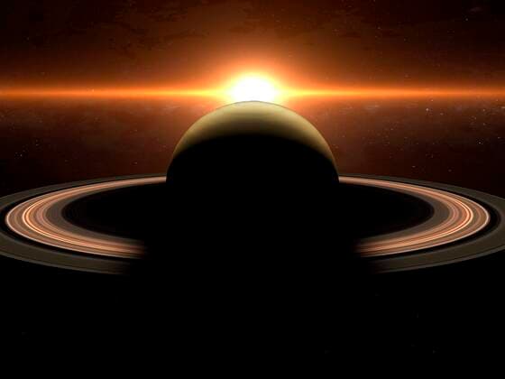 IMAGO Creative: Planeten im Sonnensystem Saturn - Symbolbilder Dramatic sunrise over the gas giant Saturn illuminating the rings concept 4050_rf_03_fi_img_0397