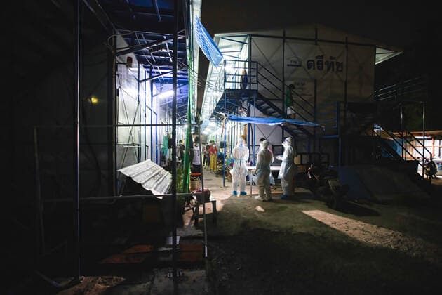 August 12, 2021, Bangkok, Thailand: Zendai volunteers wearing Personal Protective Equipment ( PPE) suits seen standing in front of the construction workers camp at Laksi..Covid-19 check-up in construction workers camp in Bangkok. Bangkok Thailand - ZUMAs197 20210812_zaa_s197_058 Copyright: xVaruthxPongsapipattx