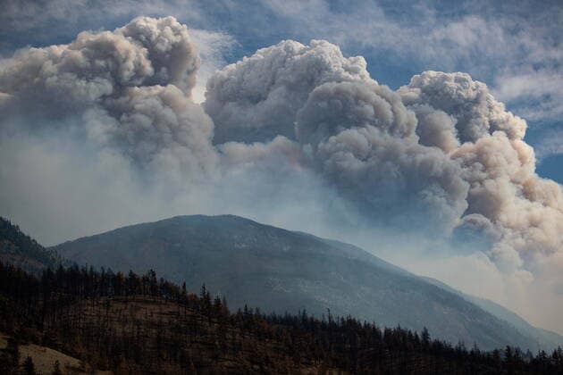 August 15, 2021, LYTTON, BC, CANADA: A pyrocumulus cloud, also known as a fire cloud, produced by the Lytton Creek wildfire rises into the sky from the fire burning in the mountains above Lytton, B.C., on Sunday, August 15, 2021. LYTTON CANADA - ZUMAc35_ 20210815_zaf_c35_105 Copyright: xDarrylxDyckx