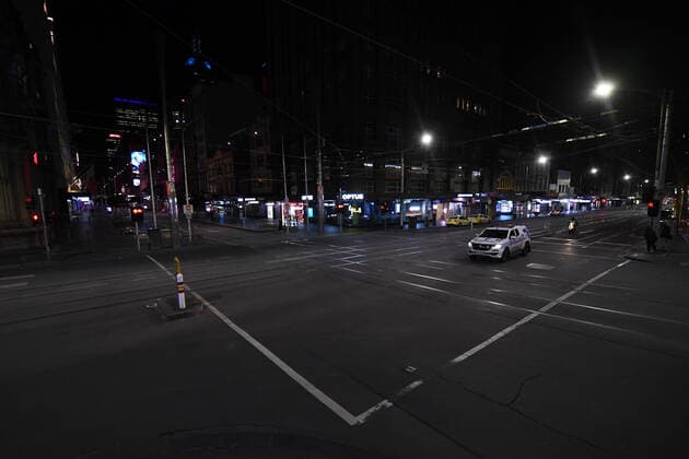 VICTORIA CORONAVIRUS COVID19, A police car is seen ahead of the curfew in Melbourne, Monday, August 16, 2021. Victorian Premier Daniel Andrews today announced a night curfew which came into effect at 11.59pm on Monday. ( NO ARCHIVING, EDITORIAL USE ONLY, NO USE IN BOOKS WITHOUT CONSENT MELBOURNE VIC AUSTRALIA  Copyright: xJAMESxROSSx 20210816001567368747