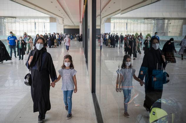 General COVID-19 Vaccination In Tehran An Iranian woman and her young girl wearing protective face masks while attending to receive a dose of a new coronavirus disease vaccine during the mass general COVID-19 vaccination in the Iran Grand Bazaar, Iran Mall, in western Tehran, August 17, 2021. Tehran Tehran Iran nikoubazl-generalc210817_npfqc  Copyright: xMortezaxNikoubazlx