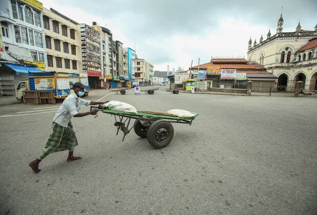 August 21, 2021, colombo, Sri Lanka: A man pushes a cart along a deserted street during a nationwide 10-days lockdown imposed to curb the spread of Covid-19 coronavirus in Colombo, Sri Lanka on August 21, 2021. colombo Sri Lanka. - ZUMAd152 20210821_znp_d152_008 Copyright: xPradeepxDambaragex