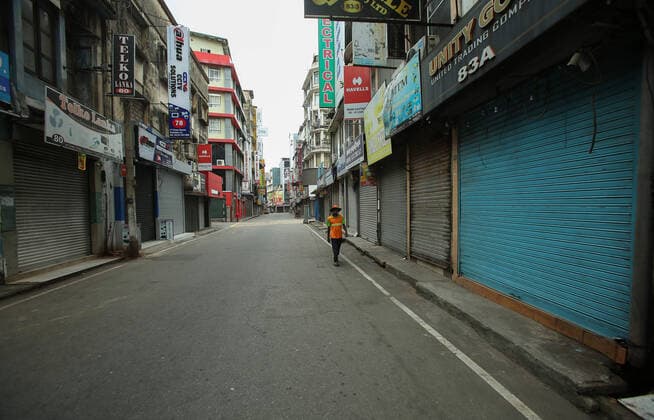 August 21, 2021, colombo, Sri Lanka: Men walks along a deserted street during a nationwide 10-days lockdown imposed to curb the spread of Covid-19 coronavirus in Colombo, Sri Lanka on August 21, 2021. colombo Sri Lanka. - ZUMAd152 20210821_znp_d152_011 Copyright: xPradeepxDambaragex