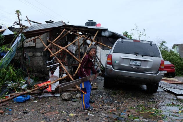 (210822) -- VERACRUZ, Aug. 22, 2021 -- A man removes debris from his home damaged by the landfall of Hurricane Grace, in Poza Rica, in the state of Veracruz, Mexico, on Aug. 21, 2021. At least eight people were dead and three missing after Hurricane Grace hit eastern Mexico, Cuitlahuac Garcia, governor of the state of Veracruz, reported on Saturday. (Photo by Xinhua) MEXICO-VERACRUZ-HURRICANE GRACE JesusxAlvarado