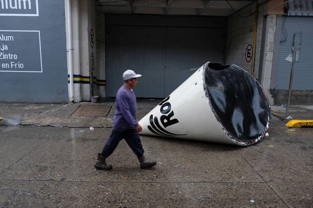 (210822) -- VERACRUZ, Aug. 22, 2021 -- A man walks in front of a structure that fell due to the rain and winds caused by the landfall of Hurricane Grace, in Poza Rica, in the state of Veracruz, Mexico, on Aug. 21, 2021. At least eight people were dead and three missing after Hurricane Grace hit eastern Mexico, Cuitlahuac Garcia, governor of the state of Veracruz, reported on Saturday. (Photo by Xinhua) MEXICO-VERACRUZ-HURRICANE GRACE JesusxAlvarado