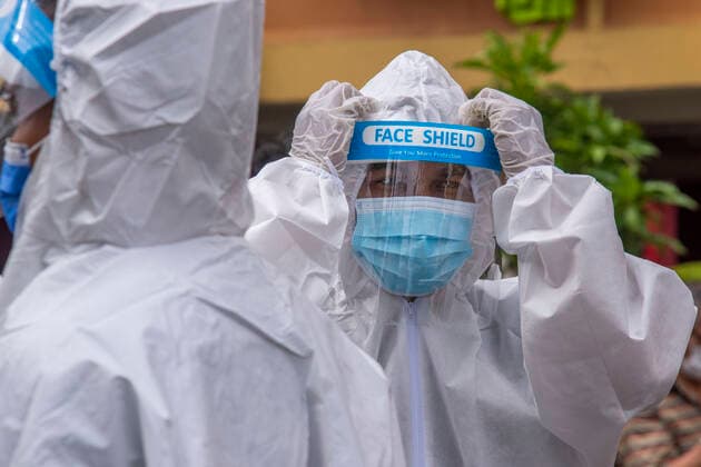 (210822) -- KUALA LUMPUR, Aug. 22, 2021 -- A firefighter puts on a face shield as conducting sanitization in the outskirts of Kuala Lumpur, Malaysia, Aug. 22, 2021. Malaysia reported another 19,807 new COVID-19 infections on Sunday, bringing the national total to 1,555,093. (Photo by Xinhua) MALAYSIA-COVID-19-CASES ChongxVoonxChung 