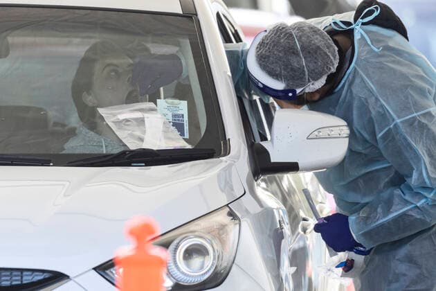 VICTORIA CORONAVIRUS COVID19, A person receives a COVID test in their car at a drive-through testing site at Shepparton Greyhound and Trotting Track in Shepparton, Victoria, Tuesday, August 24, 2021. The entire state of Victoria is back in lockdown as authorities scramble to contain a rapidly growing cluster of COVID-19 in the regional city of Shepparton. ( NO ARCHIVING, EDITORIAL USE ONLY, NO USE IN BOOKS WITHOUT CONSENT MELBOURNE VIC AUSTRALIA  Copyright: xDANIELxPOCKETTx 20210824001569353150