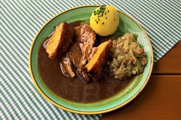 Schweinebraten (Fleisch vom Schwein) mit Sauerkraut und Knoedel *** Roast pork meat with sauerkraut and knoedel