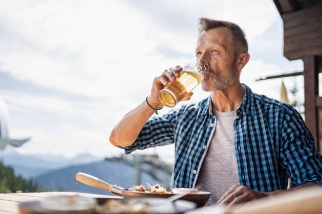 Man drinking beer while sitting at restaurant model released Symbolfoto DIGF16315