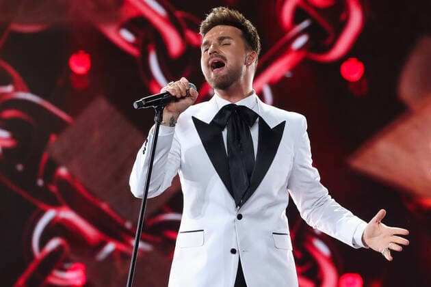 SOCHI, RUSSIA - AUGUST 25, 2021: Guest singer Alexander Panayotov performs in a gala concert on the closing day of the 2021 New Wave Song Contest, an international competition for young pop music performers. Eleven singers representing nine countries took part in the contest, which ran from 19 to 25 August. Vyacheslav Prokofyev TASS  TS10DC4F