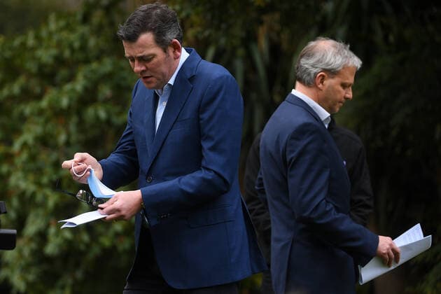 DANIEL ANDREWS COVID19 PRESSER, Victorian Premier Daniel Andrews (left) passes the Victorian Chief Health Officer Brett Sutton (right) to address the media during a press conference in Melbourne, Thursday, August 26, 2021. Victorian authorities are racing to bring the state s worsening Delta outbreak under control. ( NO ARCHIVING, EDITORIAL USE ONLY, NO USE IN BOOKS WITHOUT CONSENT MELBOURNE VIC AUSTRALIA  Copyright: xJAMESxROSSx 20210826001569802318