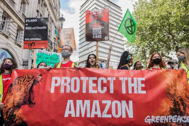 August 25, 2021, London, United Kingdom: Protesters hold a banner expressing their opinions during the demonstration..On the 3rd day of Extinction Rebellion s protests, protesters came together with the aim of demanding climate justice for the Indigenous people of Amazon rainforests in Brazil. They protest against ecocide and deforestation in Brazil. The group began their demonstration outside Brazilian Embassy in London, then moved over to Piccadilly Circus, and lastly occupying Oxford Circus. London United Kingdom - ZUMAs197 20210825_zaa_s197_405 Copyright: xBelindaxJiaox