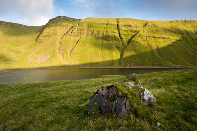 Llyn y Fan Fach lake below the Carmarthen Fans escarpment in the Brecon Beacons national Park. Copyright: xLoopxImages CraigxJoinerx CJO04421011
