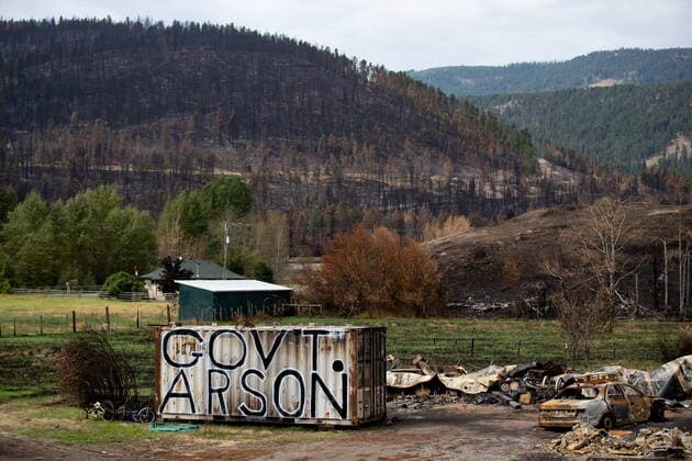 August 26, 2021, MONTE LAKE, BC, Canada: The words Government Arson are painted on a shipping container on a property that was destroyed by the White Rock Lake wildfire earlier this month, in Monte Lake, B.C., on Thursday, August 26, 2021. Many residents of the community have expressed frustration at the provincial government s response to the fire, and for criticism levelled at some who returned to the area the day after the fire moved through to try and save what remained. MONTE LAKE Canada  - ZUMAc35_ 20210826_zaf_c35_045 Copyright: xDarrylxDyckx