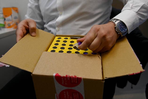 SYDNEY COVID19 VACCINATION CLINIC, Vials of the Pfizer COVID-19 vaccination are taken from a box at the Belmore Medical GP in the suburb of Belmore, Sydney, Saturday, August 28, 2021. Dr Jamal Rifi from Belmore Medical GP will be providing second doses to people who paid for their Pfizer vaccine at a GP clinic in Campsie. ( NO ARCHIVING, EDITORIAL USE ONLY, NO USE IN BOOKS WITHOUT CONSENT SYDNEY NSW AUSTRALIA  Copyright: xBIANCAxDExMARCHIx 20210828001570358121