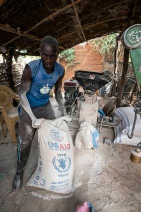 August 30, 2021, Nyala, South Darfur, Sudan: MOHAMMAD ABDULLAH ISSA operates a grain mill in the Beliel camp for internally displaced persons in South Darfur, Sudan. The fine dust of millet flour coats his hair and body after a day s work...He is one of the fortunate few to have the means to generate income in the camp. Many people return to conflict areas as farm laborers during the summer risking rebel attack, extortion, kidnapping, and rape outside the camps. Nyala Sudan - ZUMAb333 20210830_znp_b333_036 Copyright: xGreggxBrekkex