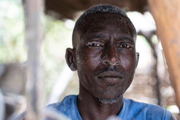 IMAGO Creative: Hunger August 30, 2021, Nyala, South Darfur, Sudan: MOHAMMAD ABDULLAH ISSA operates a grain mill in the Beliel camp for internally displaced persons in South Darfur, Sudan. The fine dust of millet flour coats his hair and body after a day s work...He is one of the fortunate few to have the means to generate income in the camp. Many people return to conflict areas as farm laborers during the summer risking rebel attack, extortion, kidnapping, and rape outside the camps. Nyala Sudan - ZUMAb333 20210830_znp_b333_037 Copyright: xGreggxBrekkex