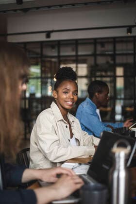 Portrait of smiling female hacker in office Sweden, Stockholm, model released, property released Copyright: xMaskotx , MA87934