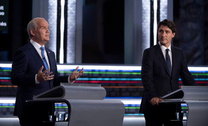 September 8, 2021, Gatineau, QC, Canada: Liberal leader Justin Trudeau looks on as Conservative leader Erin O Toole speaks during the federal election French-language leaders debate, Wednesday, September 8, 2021 in Gatineau, Que. Gatineau Canada  - ZUMAc35_ 20210908_zaf_c35_062 Copyright: xJustinxTangx