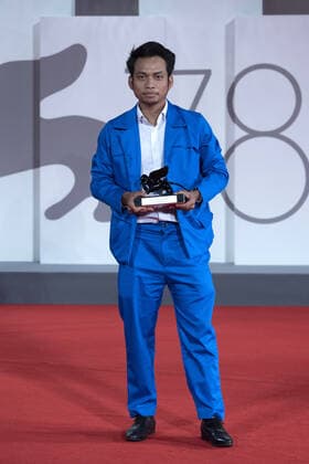September 12, 2021, Venice, Italy: Director Neang Kavich receives the Best Actor Orizzonti Award on behalf of Piseth Chhun for White Building during the Winners Red Carpet as part of the 78th Venice International Film Festival in Venice, Italy on September 11, 2021. Paolo Cotello imageSPACE Venice Italy - ZUMAs181 20210912_zea_s181_054 Copyright: xImagespacex
