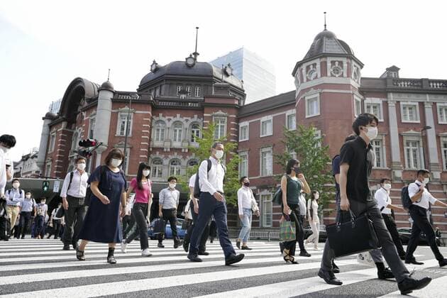 COVID-19 emergency extended in Japan People wearing face masks walk in front of JR Tokyo Station on Sept. 13, 2021, following the extension from the same day through Sept. 30 of the COVID-19 state of emergency in Tokyo and 18 other prefectures.  A14AA0000832912P