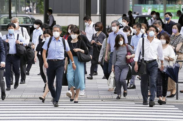 COVID-19 emergency extended in Japan People wearing face masks walk in front of JR Tokyo Station on Sept. 13, 2021, following the extension from the same day through Sept. 30 of the COVID-19 state of emergency in Tokyo and 18 other prefectures.  A14AA0000832913P