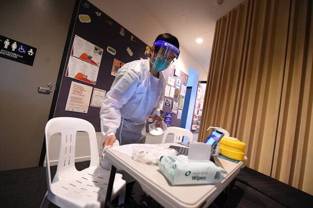VICTORIA CORONAVIRUS COVID19, Healthcare worker Suman Rai sanitises a workspace at a pop-up Covid19 vaccination clinic in Broadmeadows, Melbourne, Wednesday, September 15, 2021. Victoria s long-awaited roadmap out of lockdown will be released on Sunday, the premier has confirmed, as a man in his 20s became one of the state s latest COVID-19 victims. ( NO ARCHIVING, EDITORIAL USE ONLY, NO USE IN BOOKS WITHOUT CONSENT MELBOURNE VIC AUSTRALIA  Copyright: xJAMESxROSSx 20210915001576353481