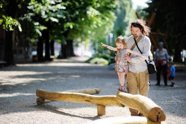 Father and daughter playing in the park at summer 1053_RF_27_31956382