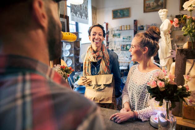 Two happy young female customers buying from vintage shop, 07.12.2015, Copyright: xFrankxVanxDelftx, model released, buying,wearing,shopping,working,sell,small business,abundance,consumerism,retro,style,indulgence,happiness,vintage,paper bag,35 to 39 years,25 to 29 years,caucasian ethnicity,mixed race ethnicity,multi-ethnic group,female,woman,young woman,male,man,mid adult man,customer,shopper,three people,two people,sales assistant,indoors,casual clothing,smiling,check-out,quaint,small business owner,treat,bun,both male and female,second hand,vintage shop,December 2015 Release,goods,Buying,Selling,Shopping,Working,Caucasian Ethnicity,Mixed Race Person,Multi-Ethnic Group,Mid Adult,35-39 Years,Young Adult,25-29 Years,Female,Women,Young Wo Ref:IS09AU8H9