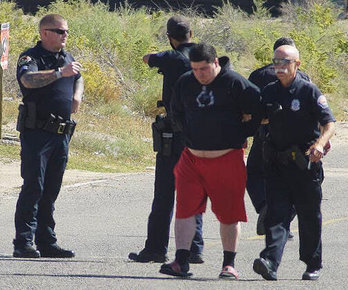 September 19, 2021, NEW MEXICO, USA: 091921.APD take a suspect into custody after a homeless man shot and killed at Central and 98th Street . Photographed on Sunday September 19, 2021. USA - ZUMAab1_ 20210919_zaf_ab1_005 Copyright: xAdolphexPierre-Louis Journalx