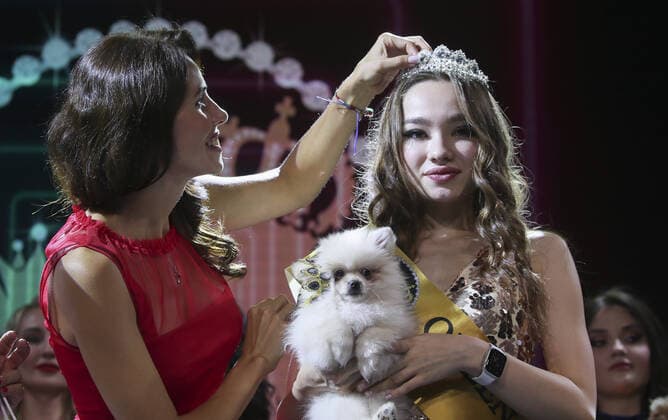 MOSCOW, RUSSIA â€“ SEPTEMBER 28, 2021: A dog with its owner Tina Ilina at a ceremony to present the 2021 Golden Pet Awards at the Federation Tower of the Moscow International Business Centre. Vladimir Gerdo TASS  TS1125A9
